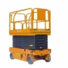 Photo of a collapsed Ekko scissor lift with a yellow safety cage and black scissor mechanism on a gray base.